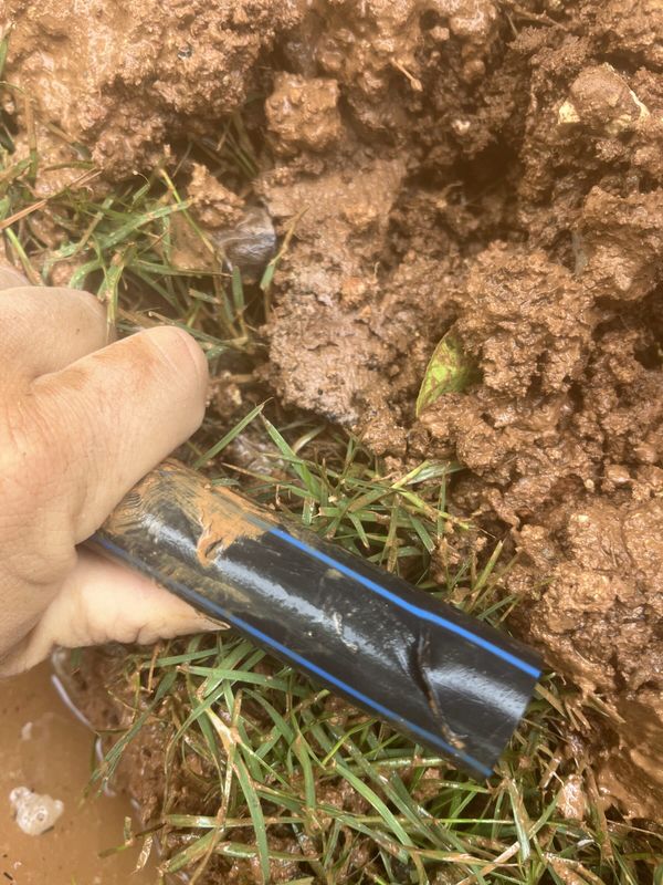A split section of main irrigation line held in hand at Sant Joan